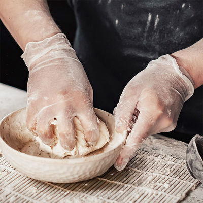 Half Met een laag bedekt van het de Handnitril van de fabrieksprijs Beschikbare Latex Gepoederde Duidelijke de Doos Witte Blauwe Vinylhandschoen van de Examenrang
